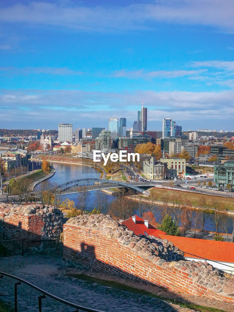 High angle view of river and buildings against sky