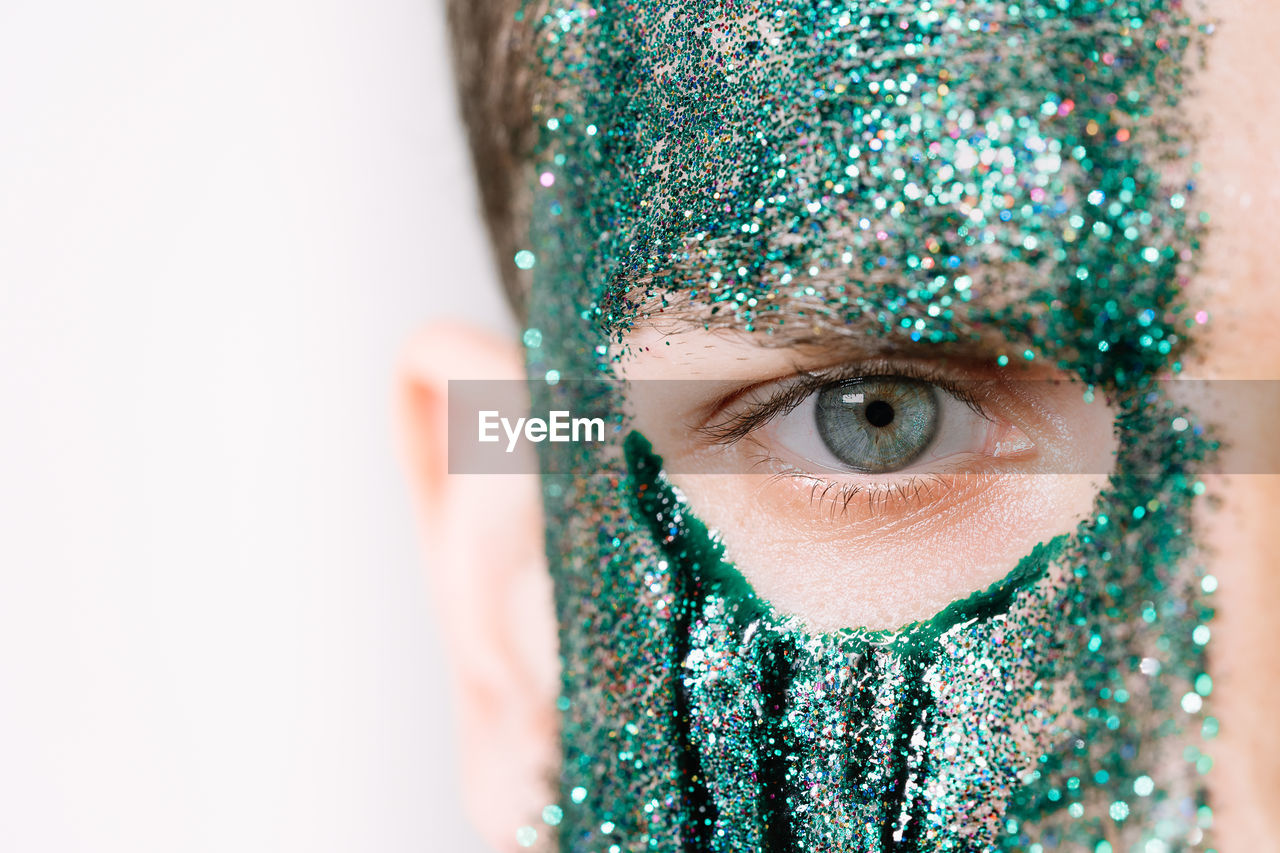 Close-up of human face with glitter