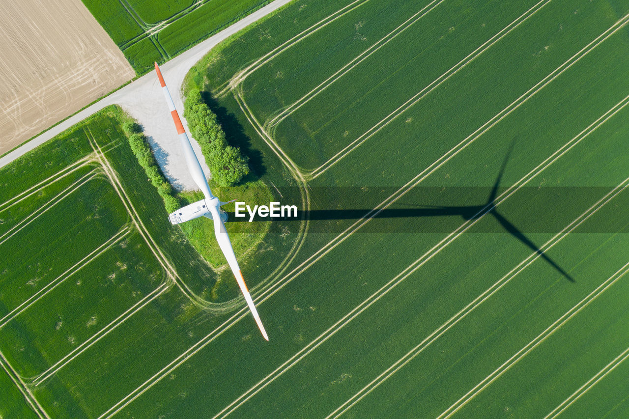 Wind turbine seen vertical from above with shadow