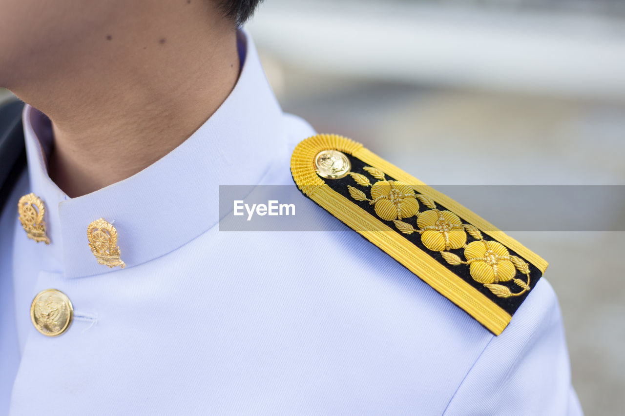 Midsection of military man wearing uniform