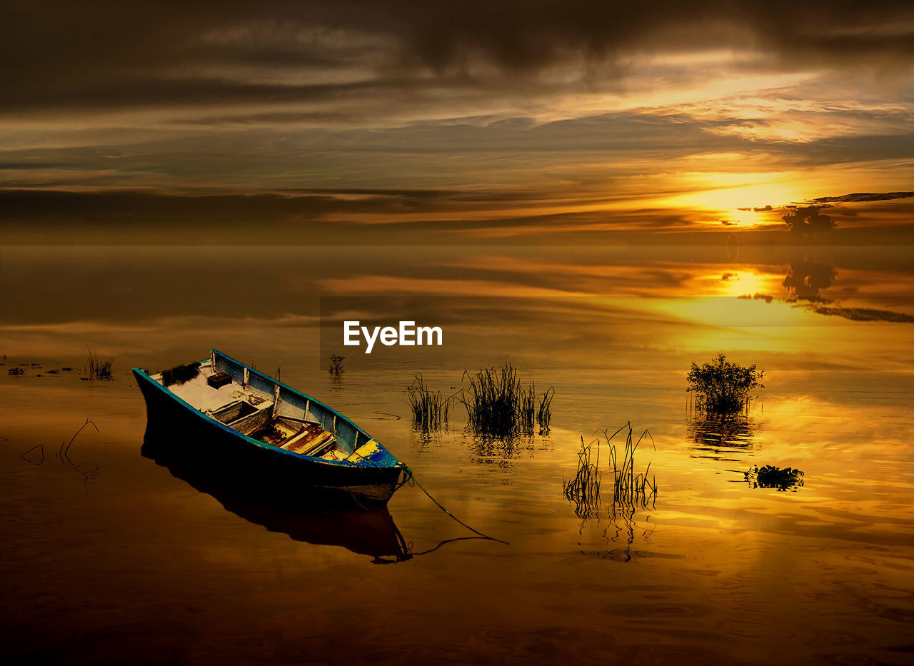 FISHING BOAT MOORED IN SEA AGAINST SKY DURING SUNSET