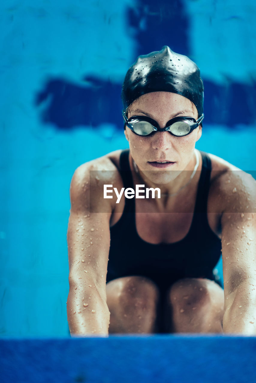 Woman in swimming pool during competition