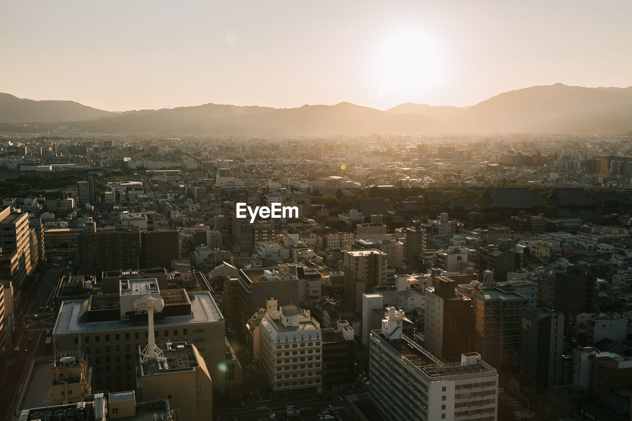 High angle view of townscape against sky during sunset