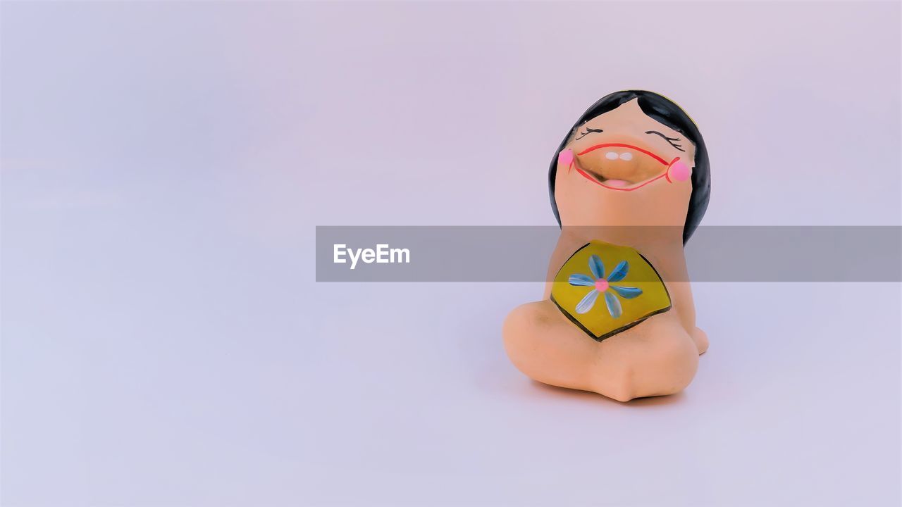 Close-up of toy against white background
