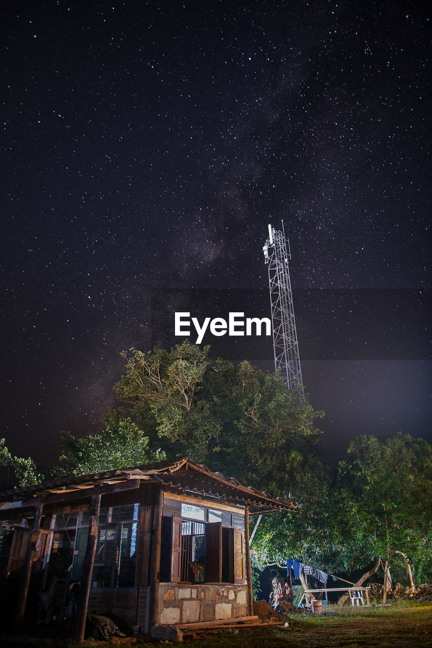 LOW ANGLE VIEW OF TREES AND BUILDING AGAINST SKY