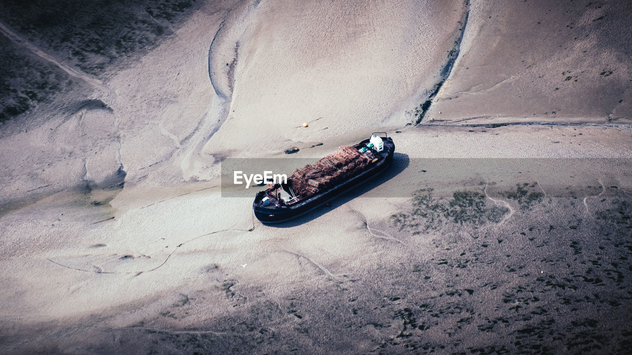 High angle view of boat moored on beach