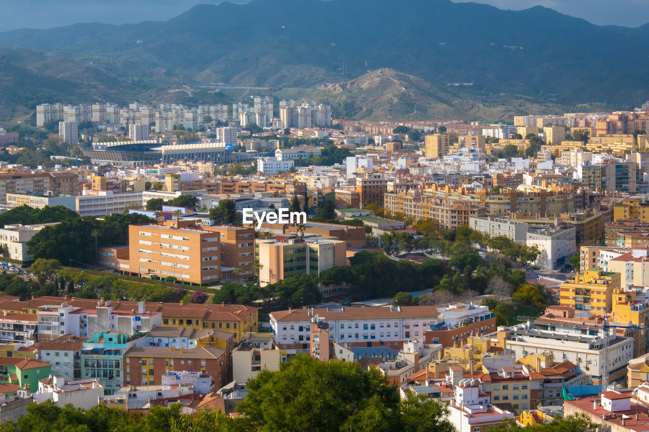 High angle view of townscape against mountains