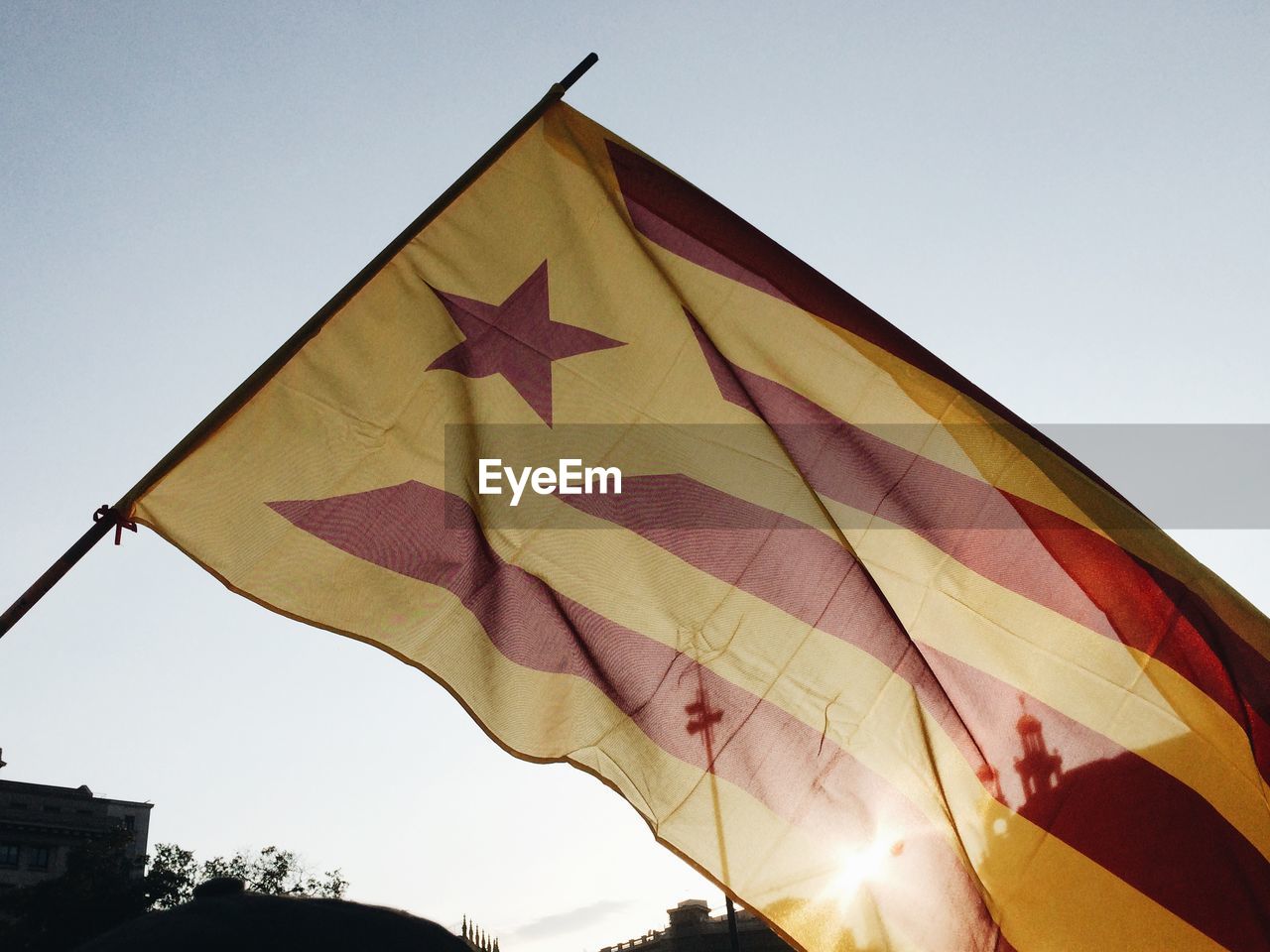Low angle view of estelada flag against clear sky