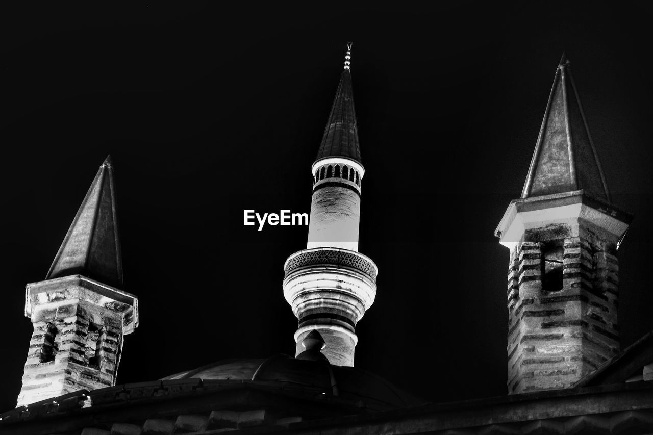 LOW ANGLE VIEW OF MOSQUE AGAINST SKY AT NIGHT