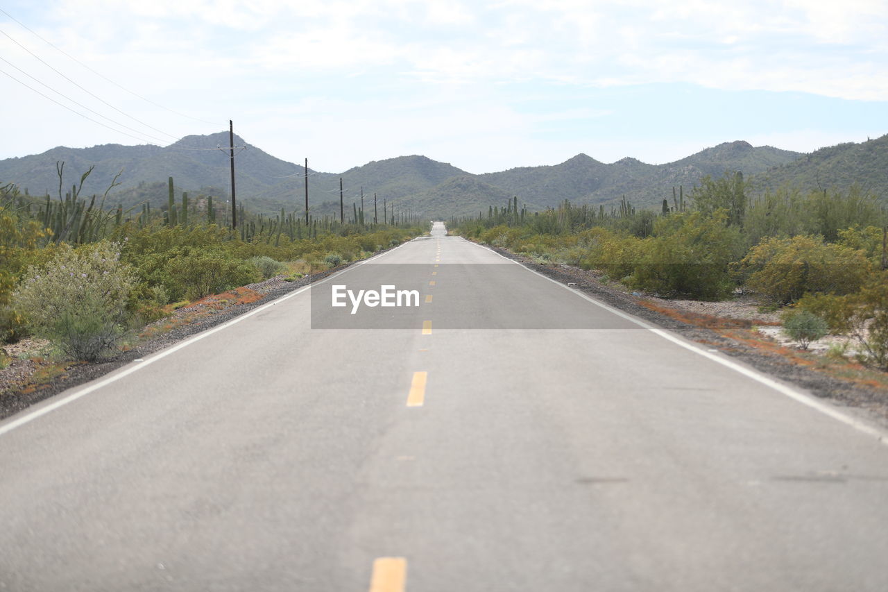 ROAD LEADING TOWARDS MOUNTAINS