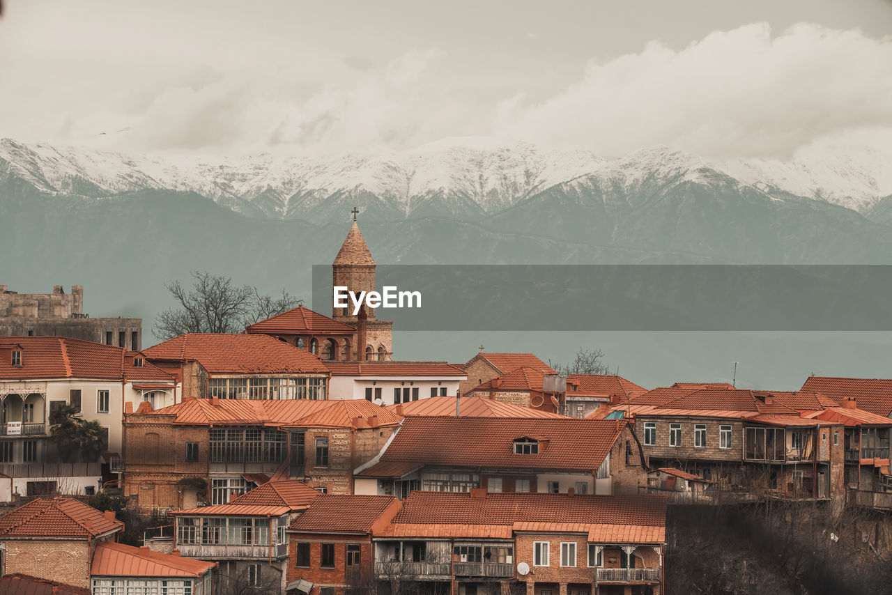 buildings in town against sky