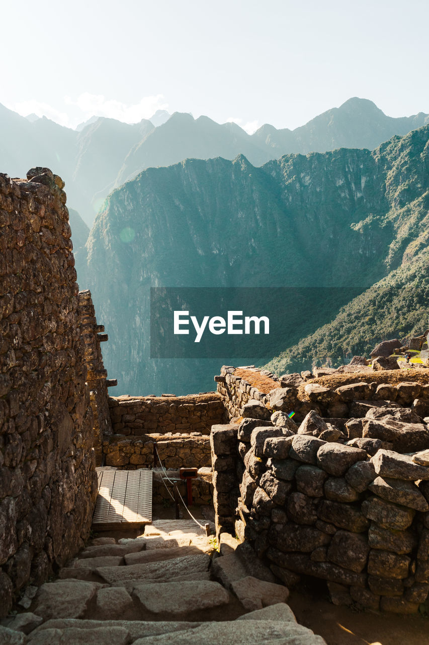 Machu picchu old inca ruins at sunrise in peru