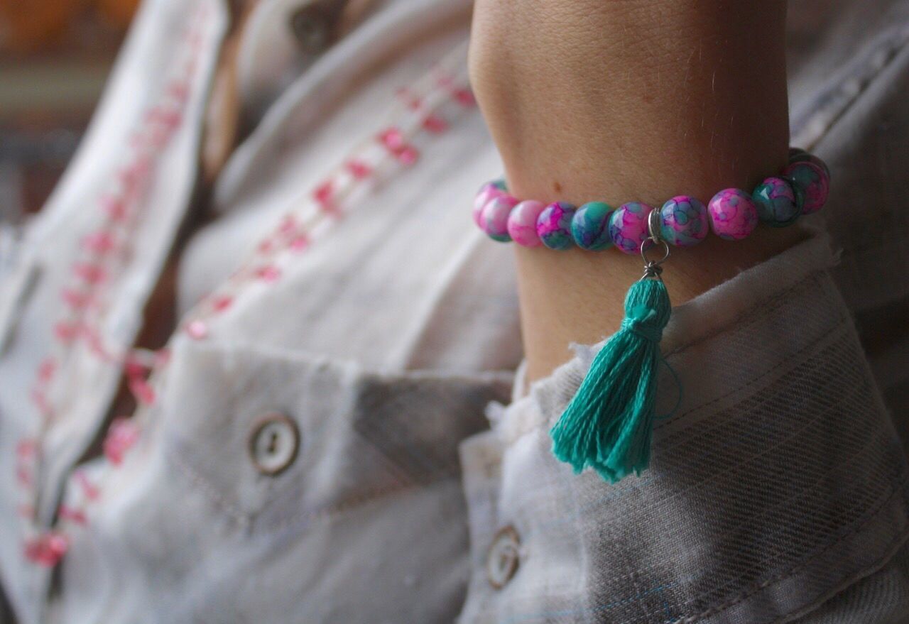 CLOSE-UP OF WOMAN HAND TIED TO