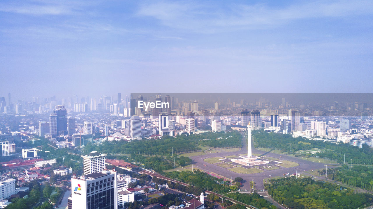 HIGH ANGLE VIEW OF BUILDINGS AGAINST SKY