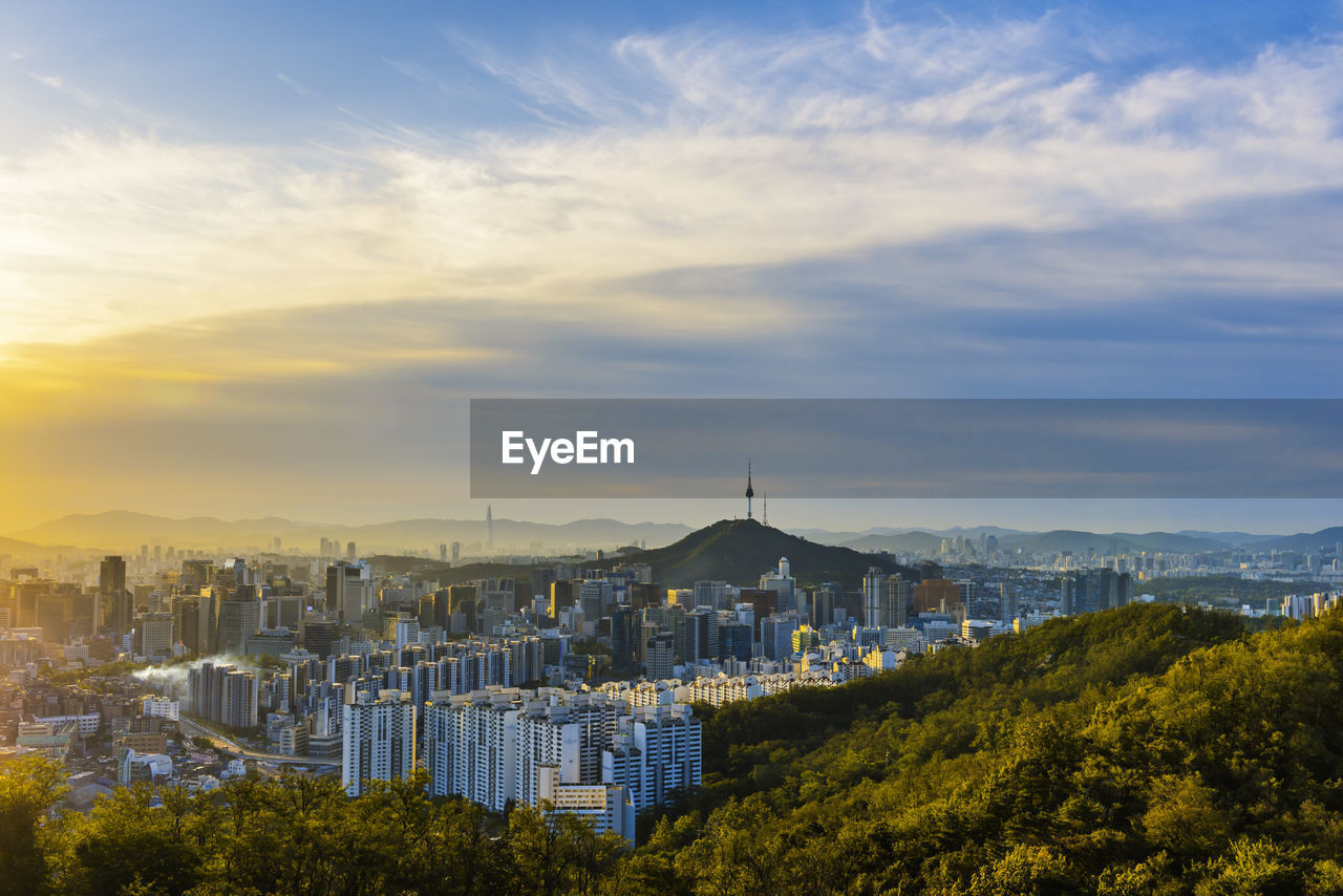 High angle view of buildings against sky during sunset