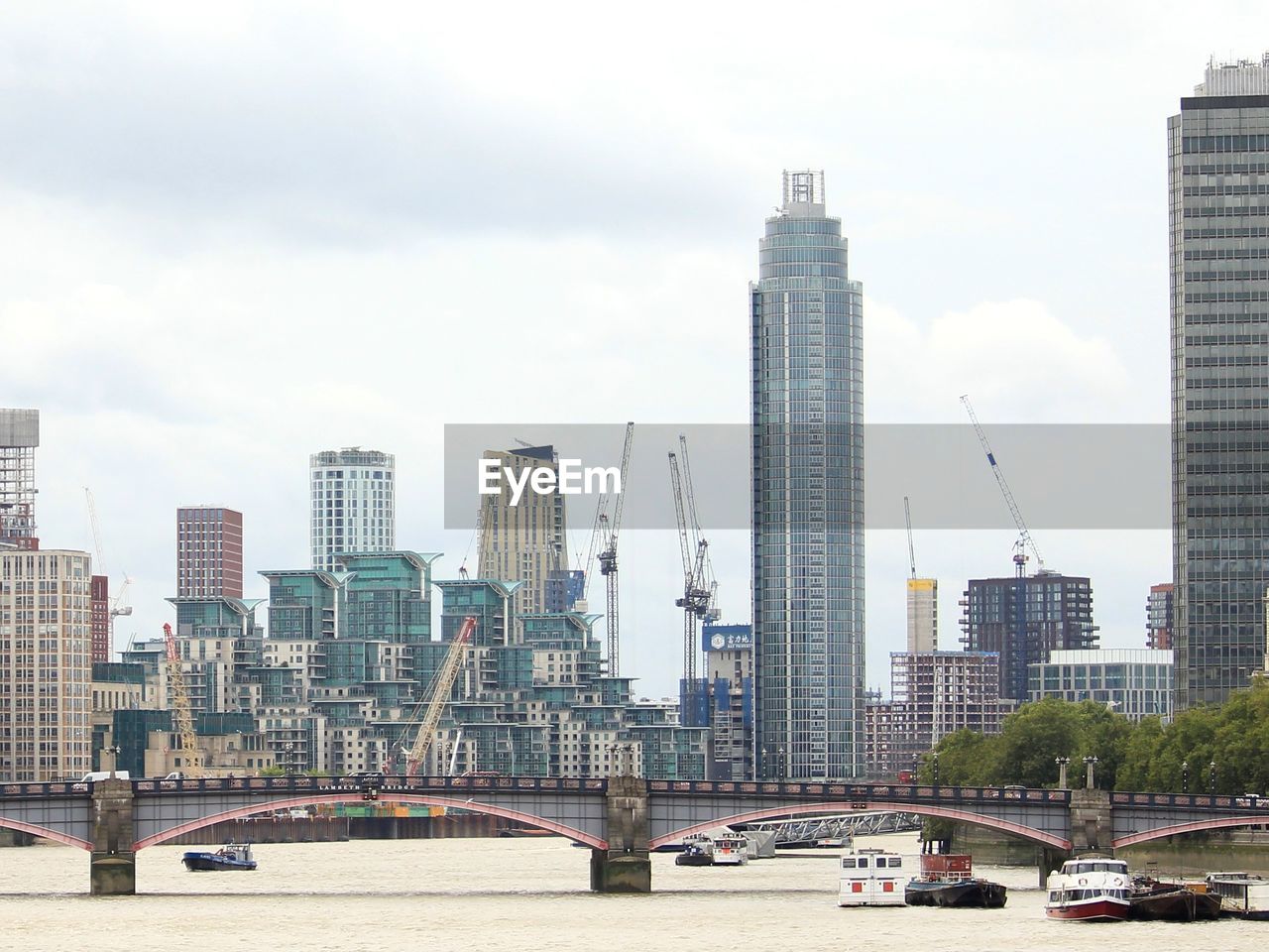 Modern buildings in city against sky