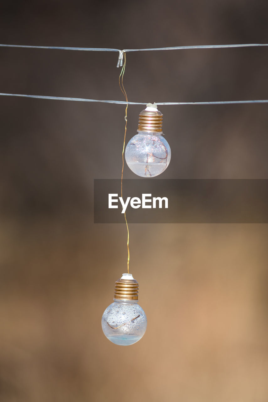 low angle view of light bulb against blurred background