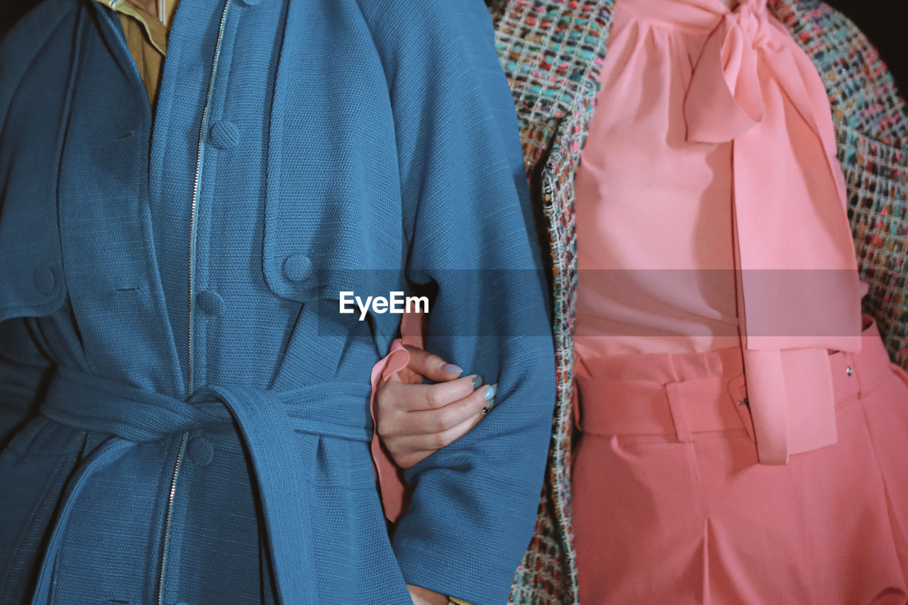 Fashion details of blue coat and pink blouse. lifestyle details. casual clothing