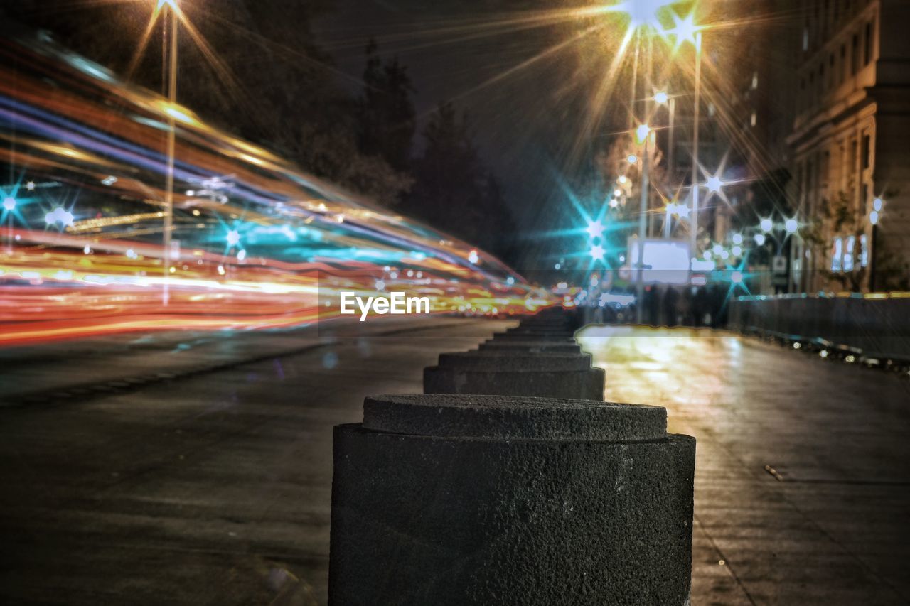 Light trails on road in city at night