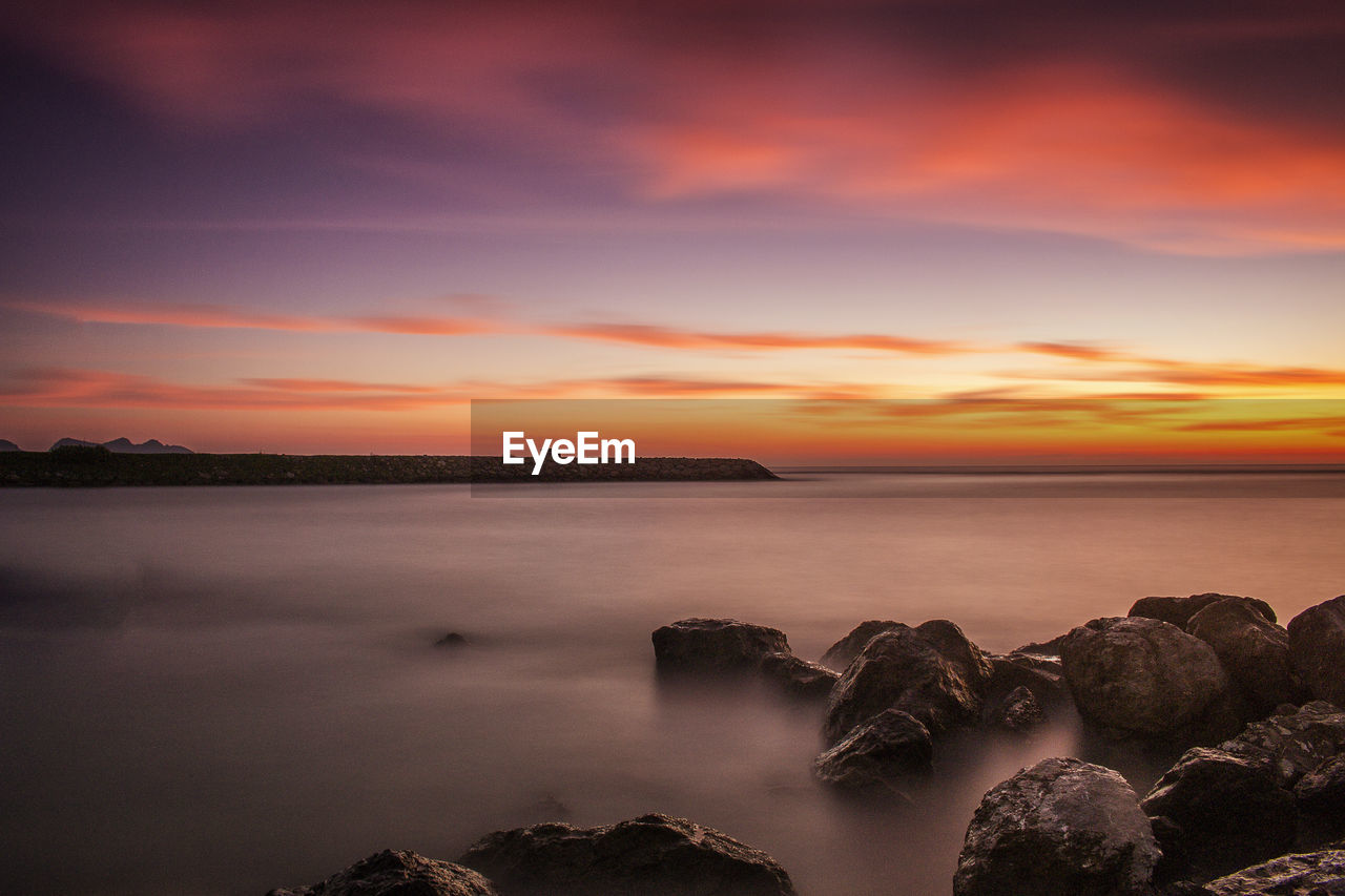 Scenic view of sea against sky during sunset