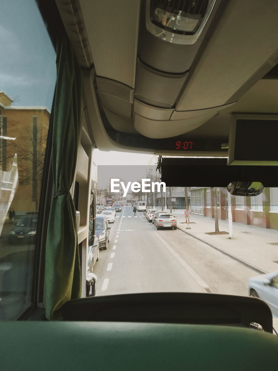 VEHICLES ON ROAD SEEN THROUGH WINDSHIELD