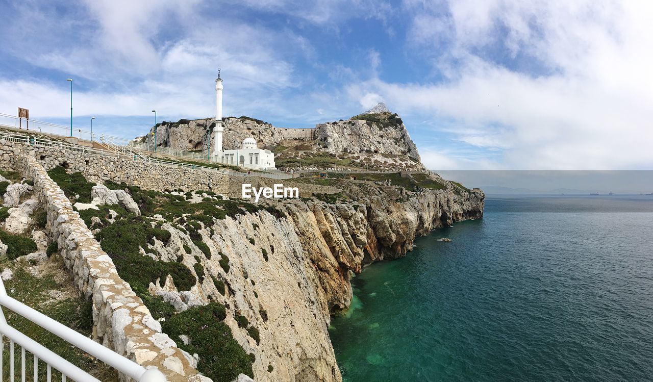 VIEW OF SEA AGAINST CLOUDY SKY