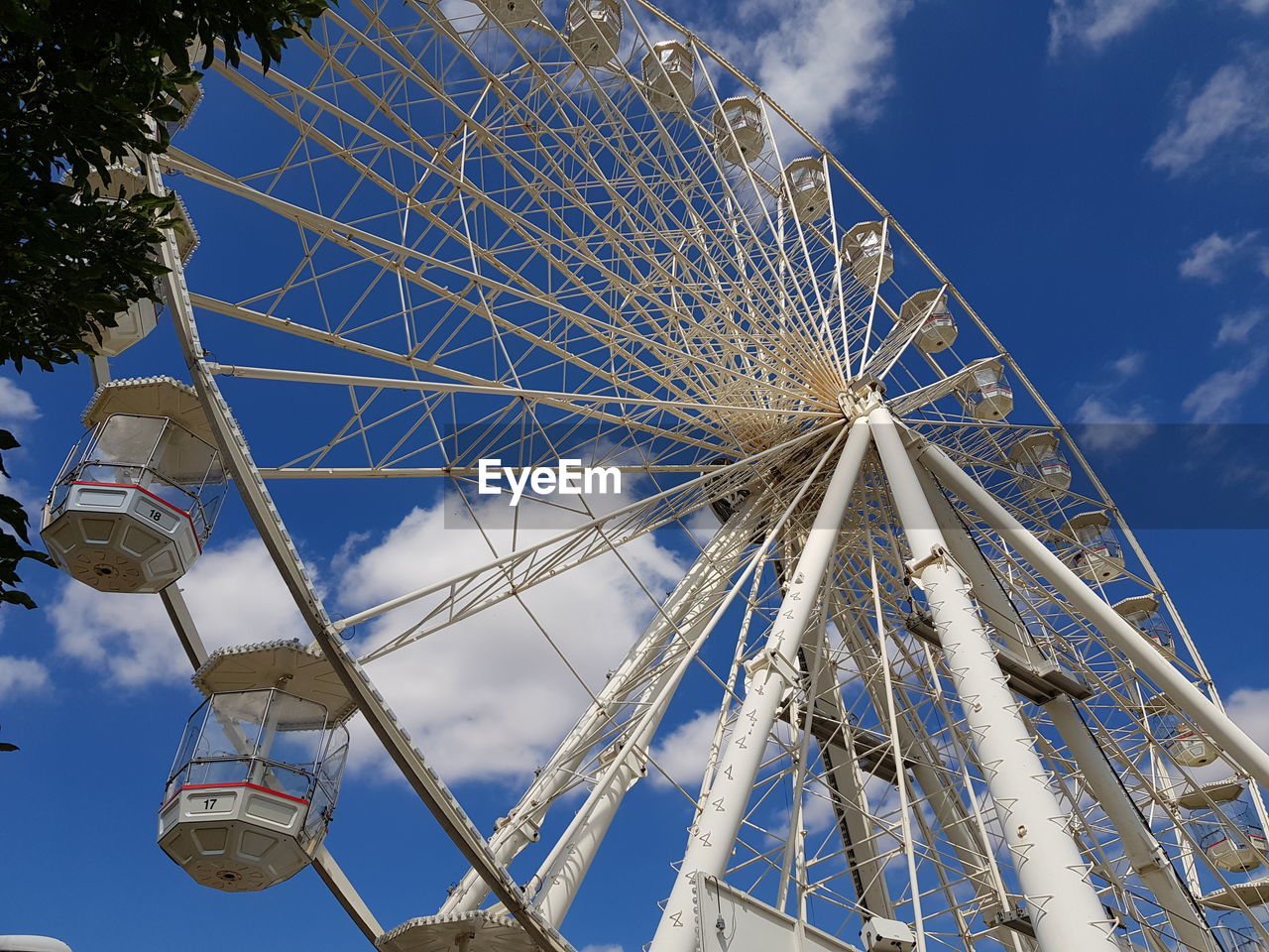 Low angle view of ferris wheel against sky