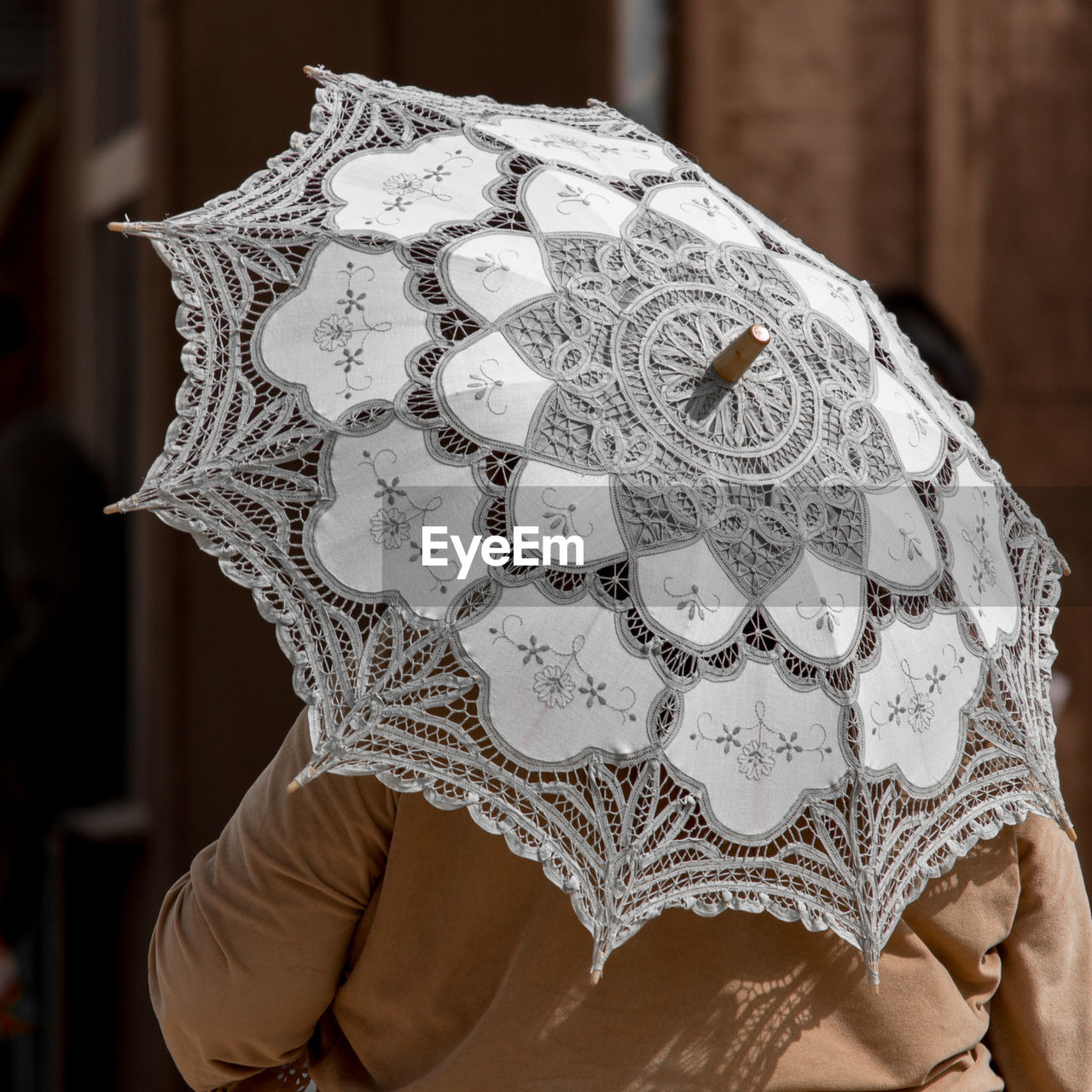 Cropped image of person with umbrella
