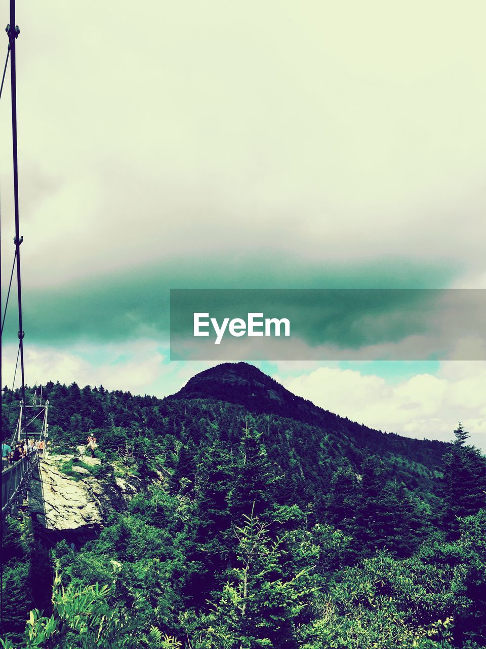 High angle view of mountain against cloudy sky