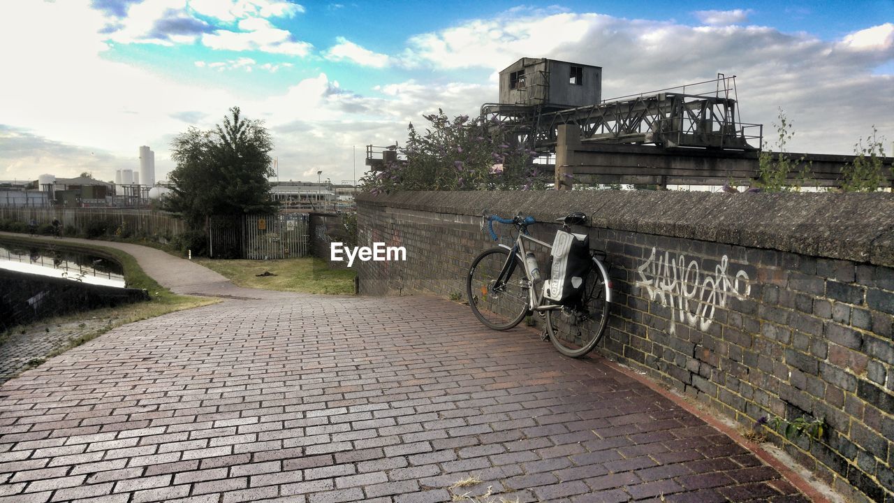 BICYCLE IN CITY AGAINST SKY