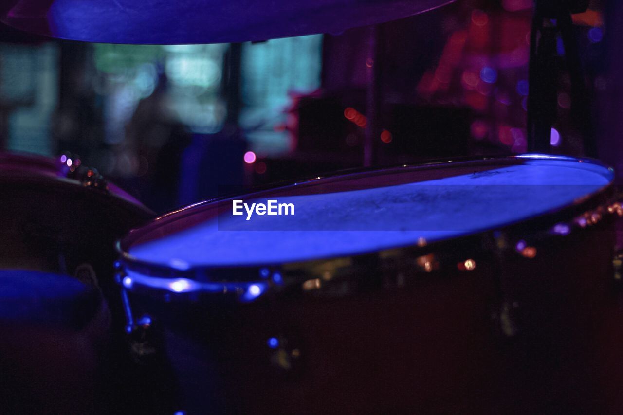 Close-up of drum set at night