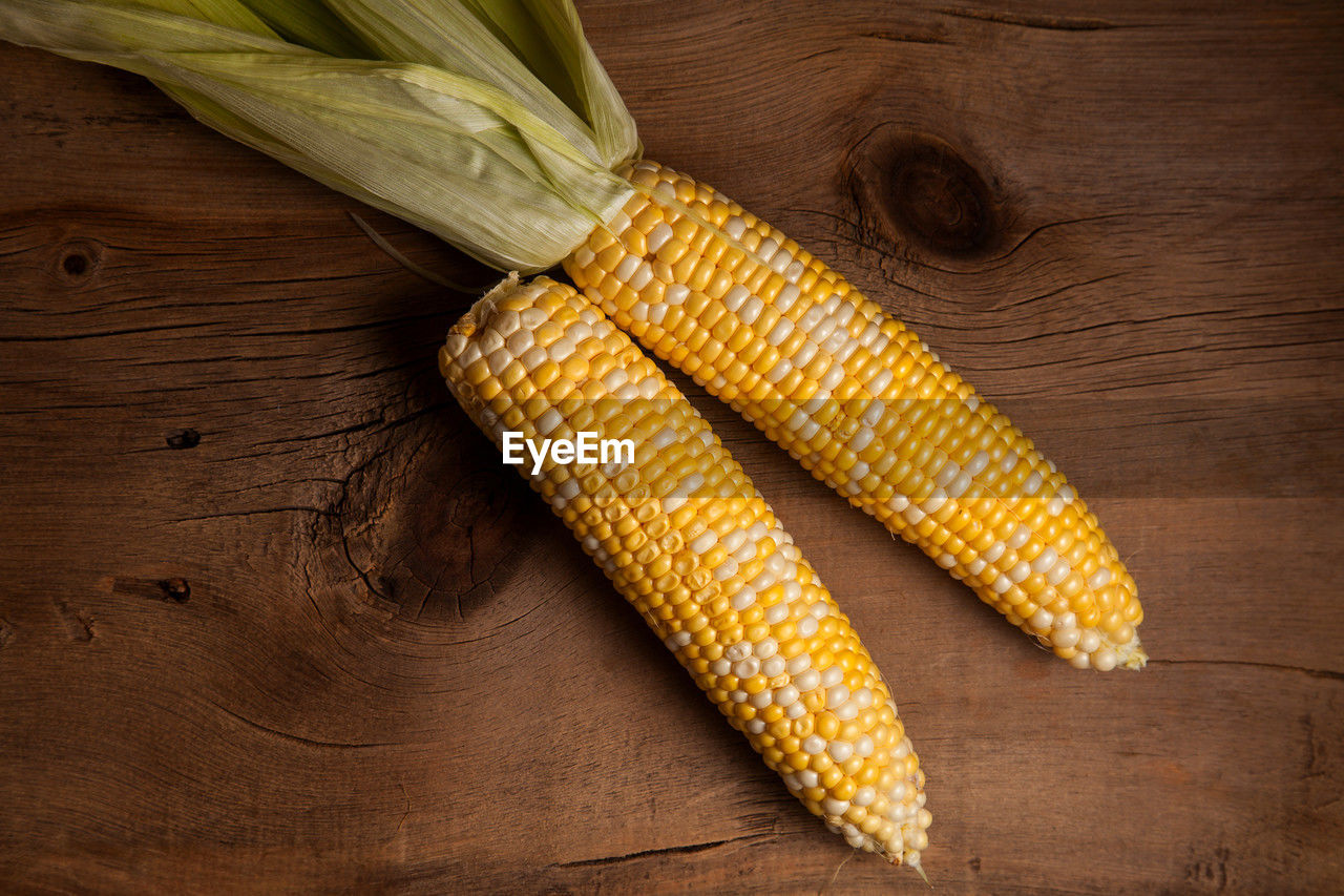 high angle view of corn on wooden table