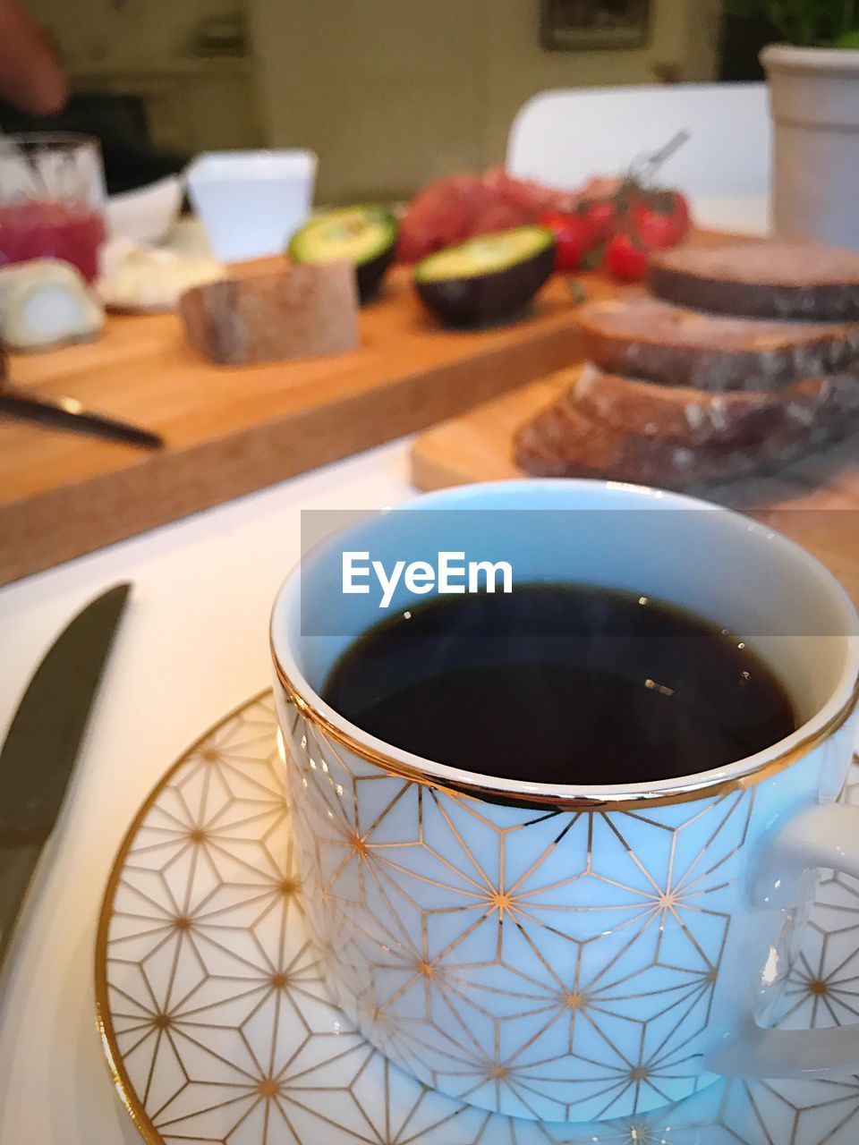 CLOSE-UP OF COFFEE ON TABLE