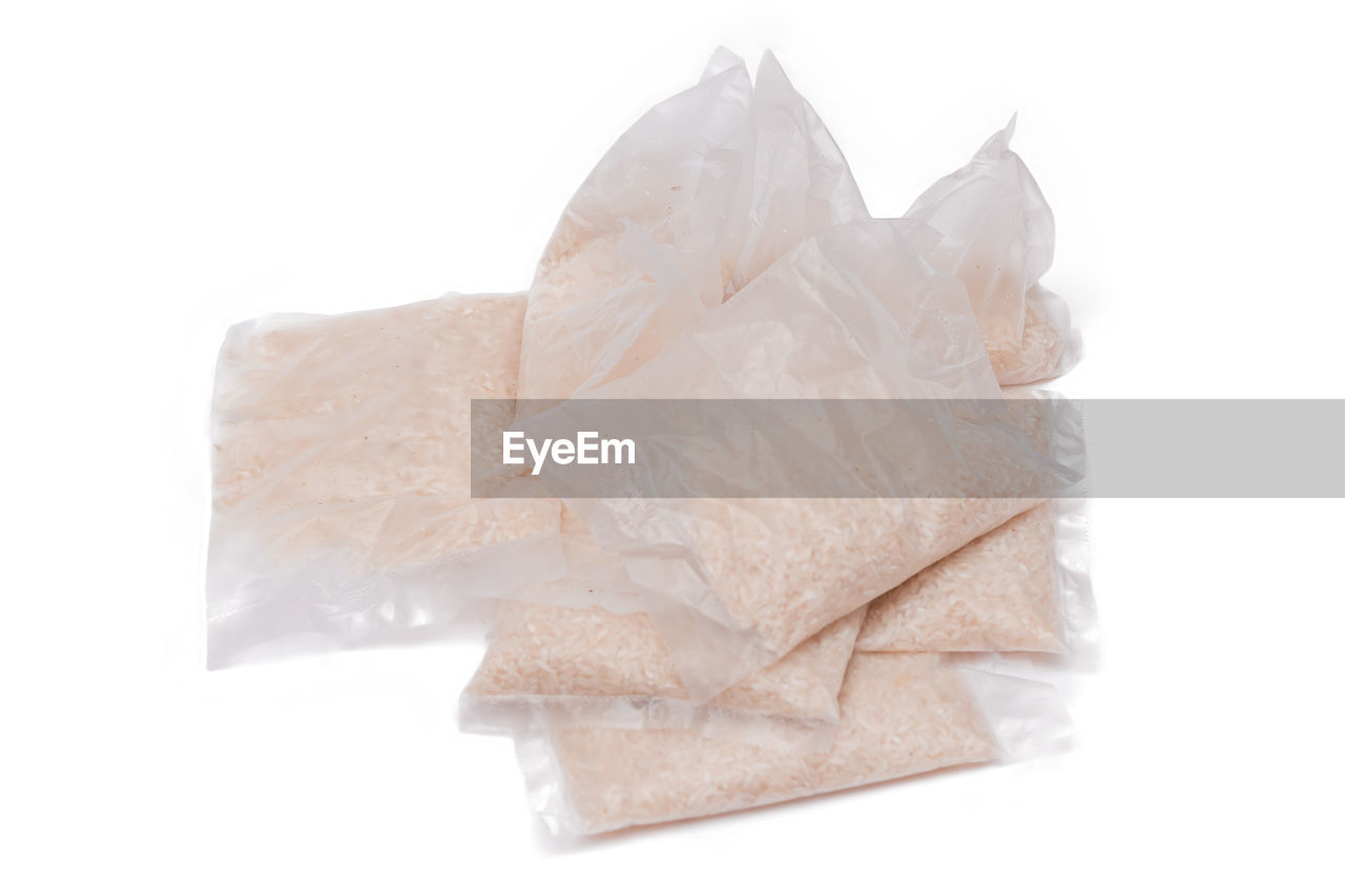 white background, cut out, paper, white, studio shot, no people, crumpled, indoors, food and drink, single object, petal, crumpled paper, bag, food