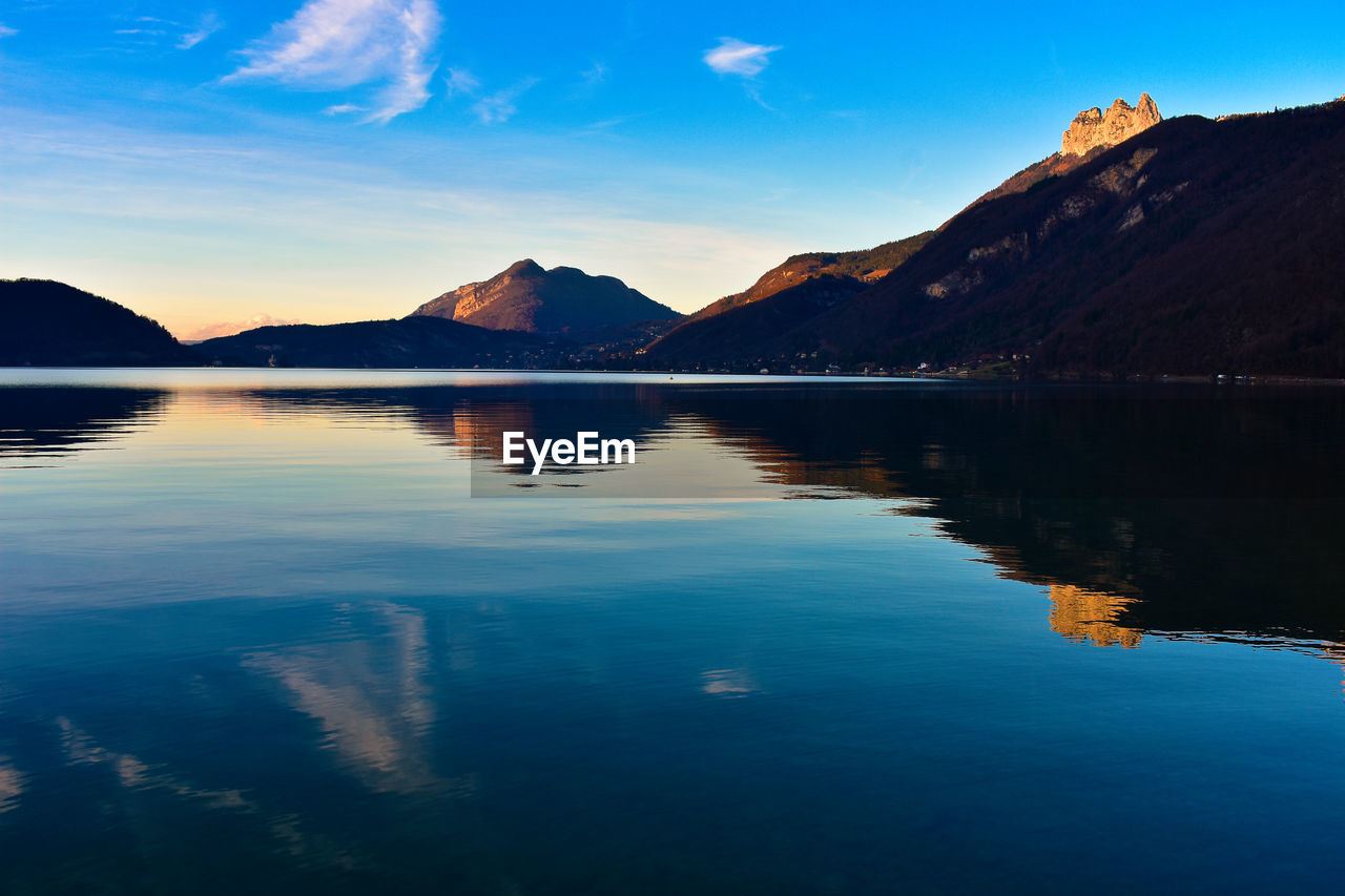 Scenic view of lake against sky during sunset