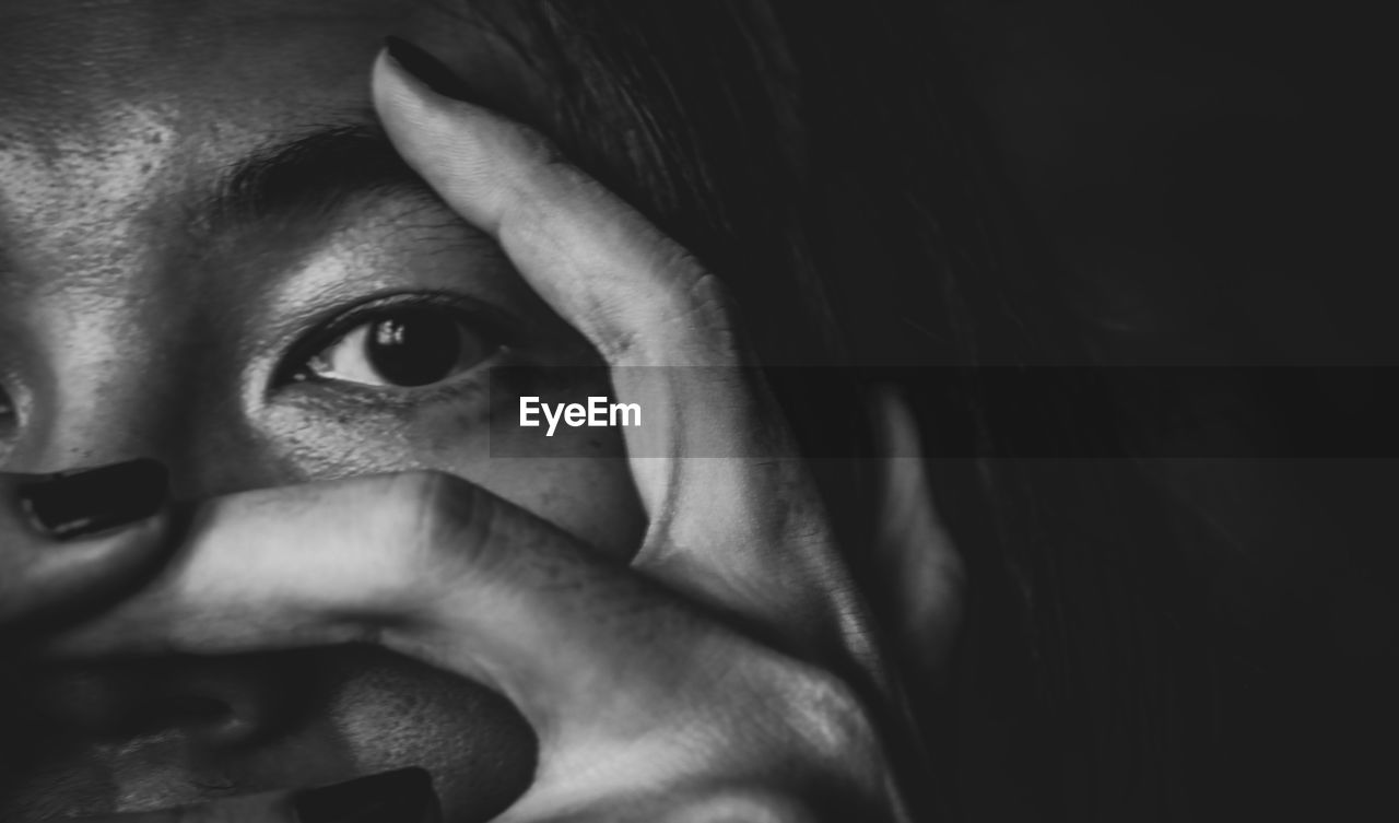 black, one person, portrait, darkness, human face, close-up, black and white, headshot, looking at camera, adult, women, indoors, white, human eye, monochrome, monochrome photography, young adult, human head, eye, nose, lifestyles, emotion, front view, looking, dark, female, person, studio shot, human mouth