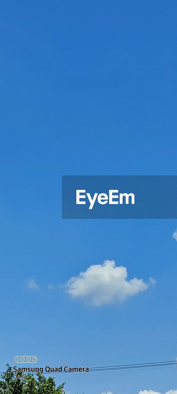 AERIAL VIEW OF SEA AGAINST BLUE SKY