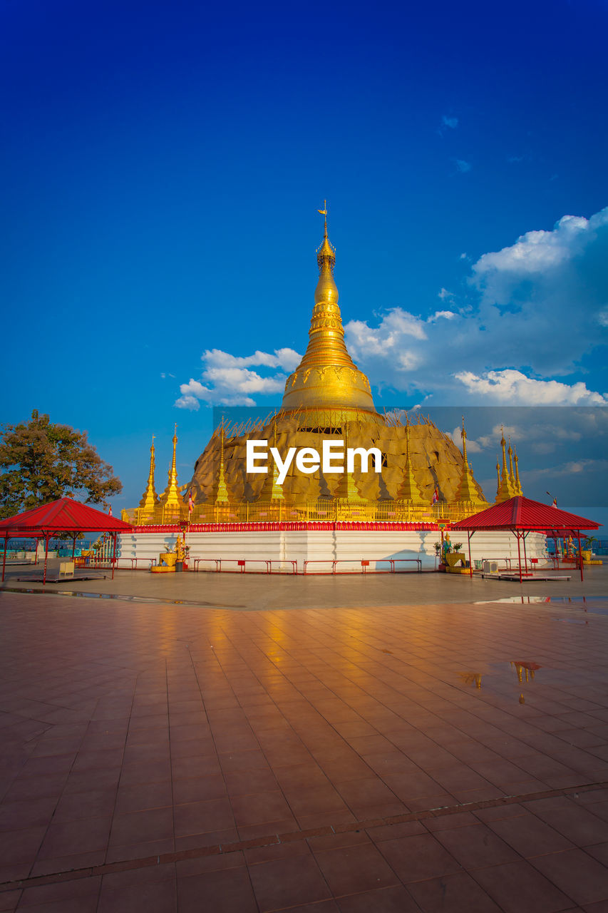 TEMPLE AGAINST CLOUDY SKY