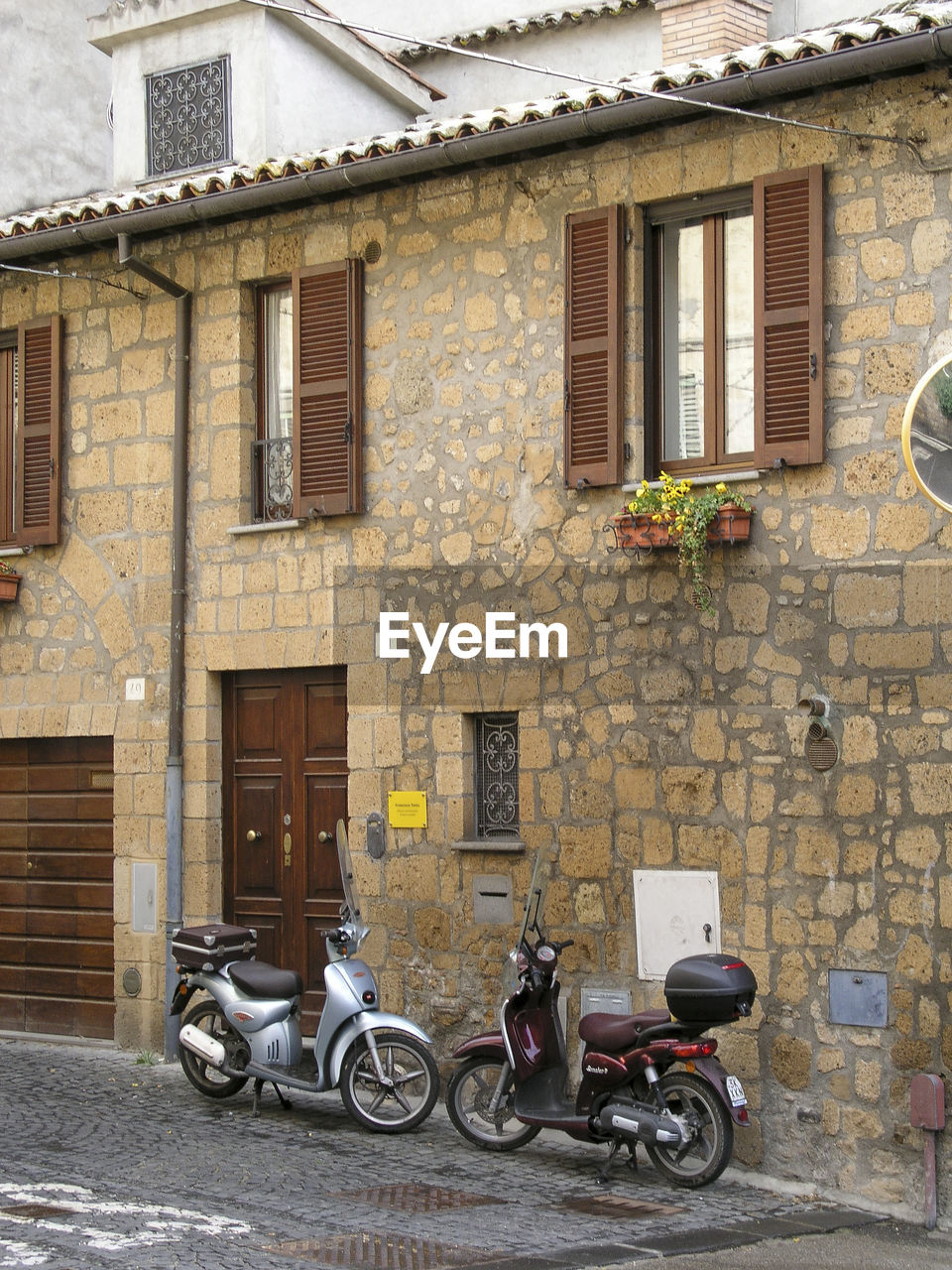 BICYCLES ON STREET AGAINST BUILDINGS