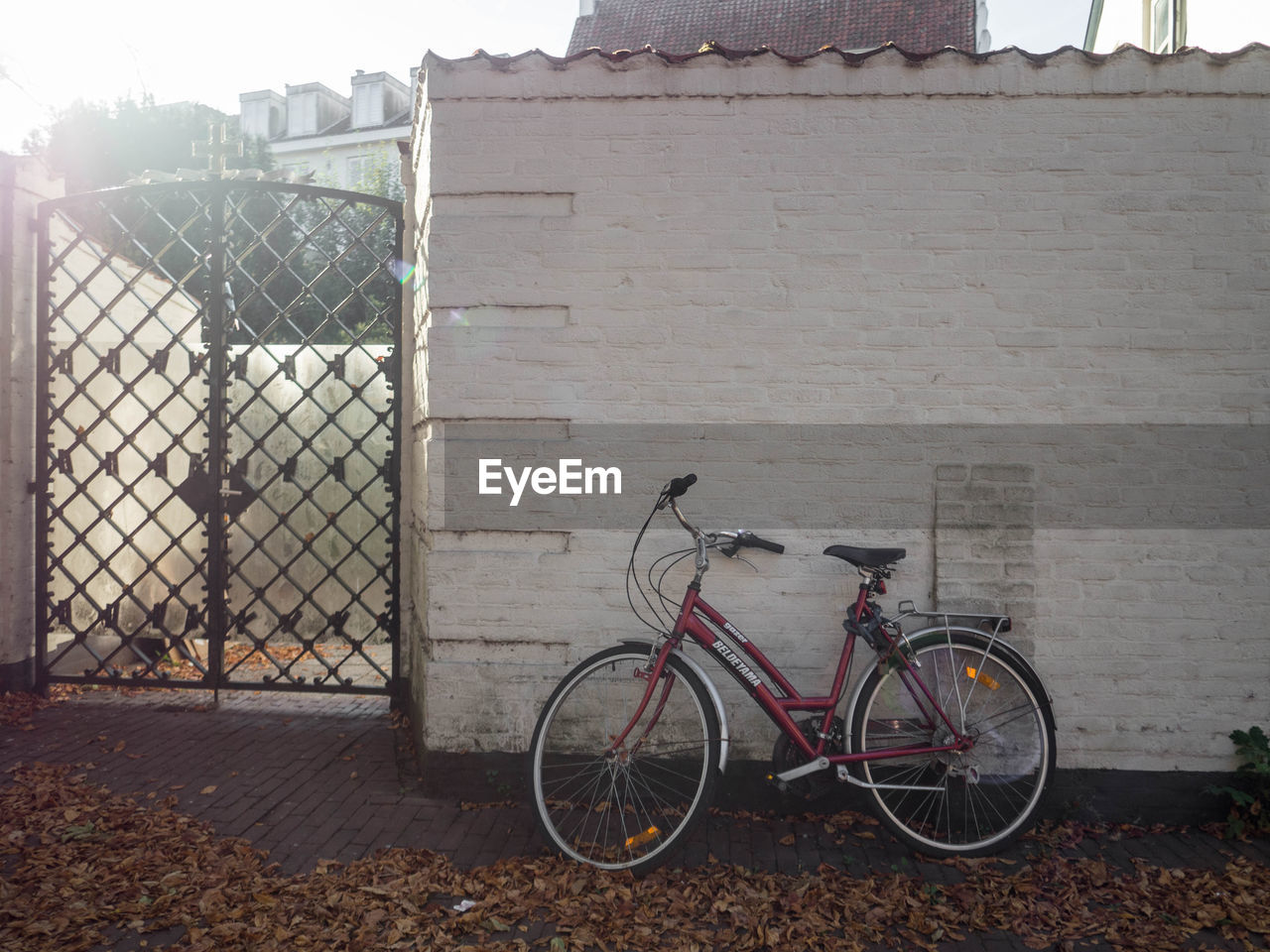 BICYCLE AGAINST BUILDING