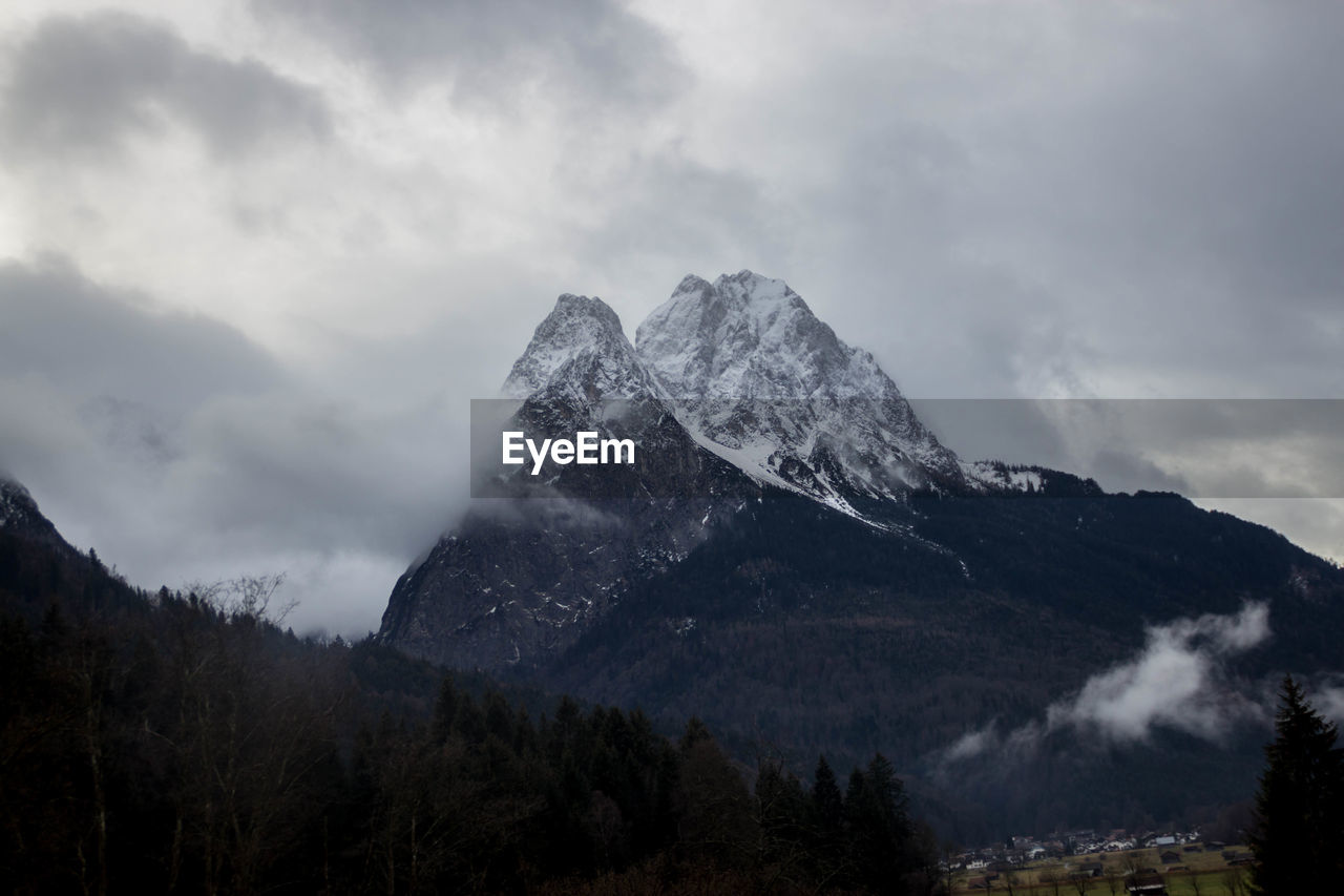 Scenic view of snowcapped mountains against sky