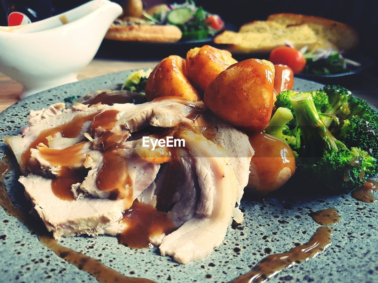 Close-up of roast pork served in plate on table