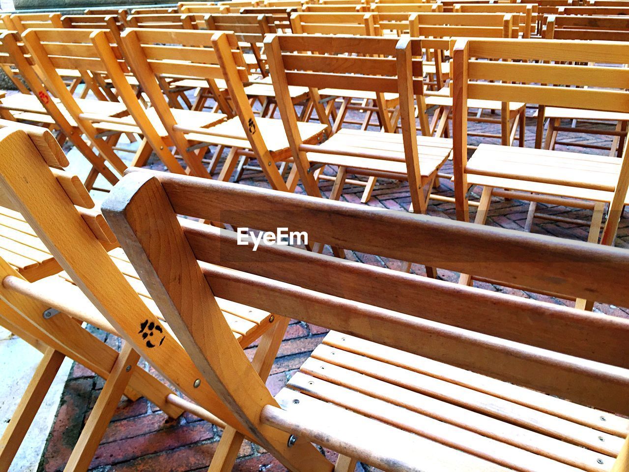 Empty wooden chairs on floor