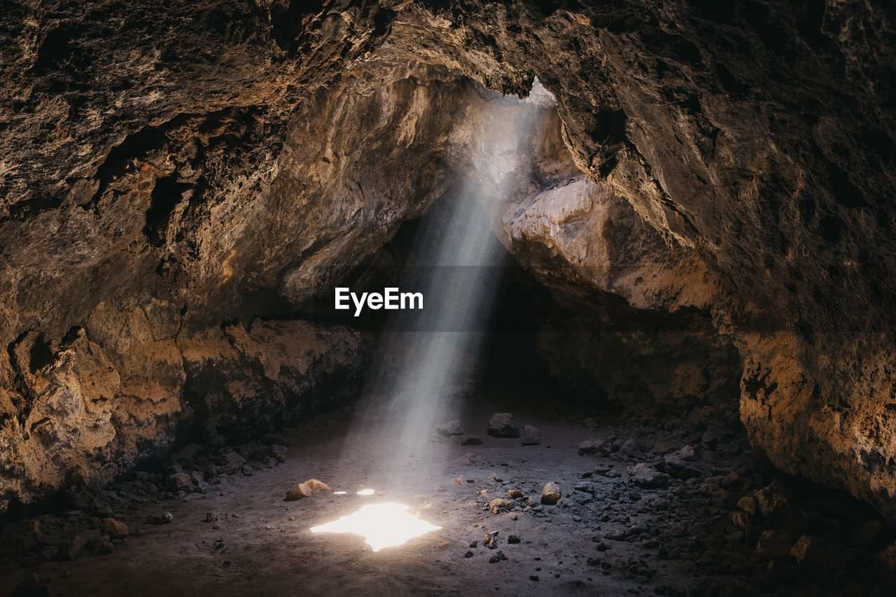 Light beam cuts through the desert lava cave