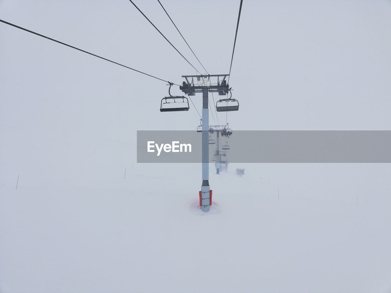 Ski lift going into the misty mountain