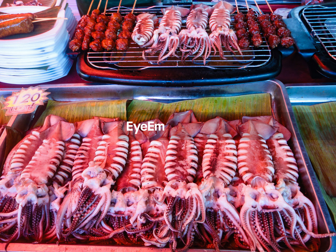 High angle view of grilles squids for sale in market