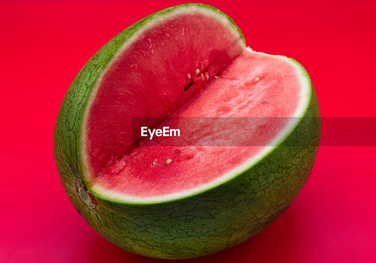 Fresh watermelon isolated on red background. fresh summer fruit.