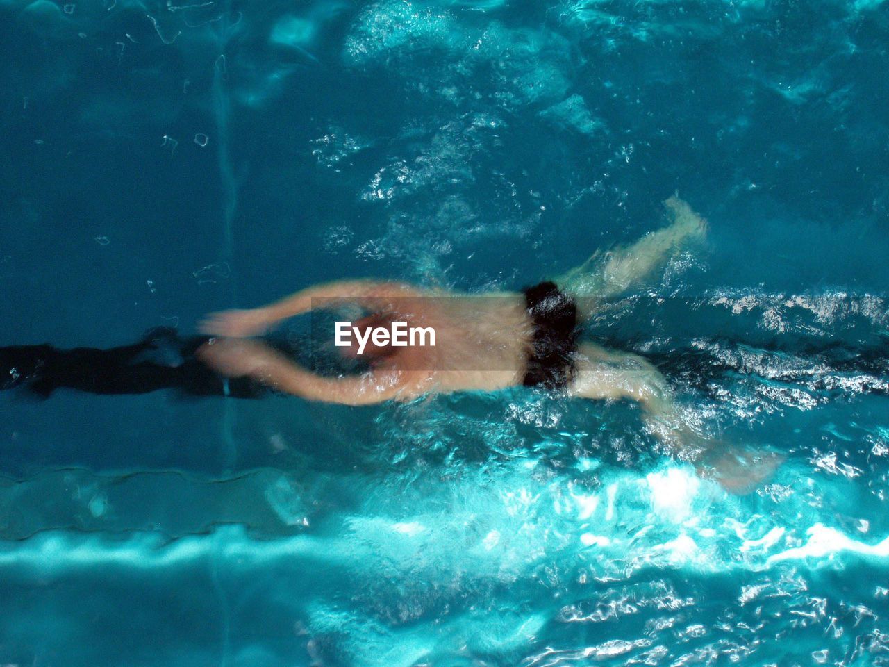 High angle view of man swimming in pool