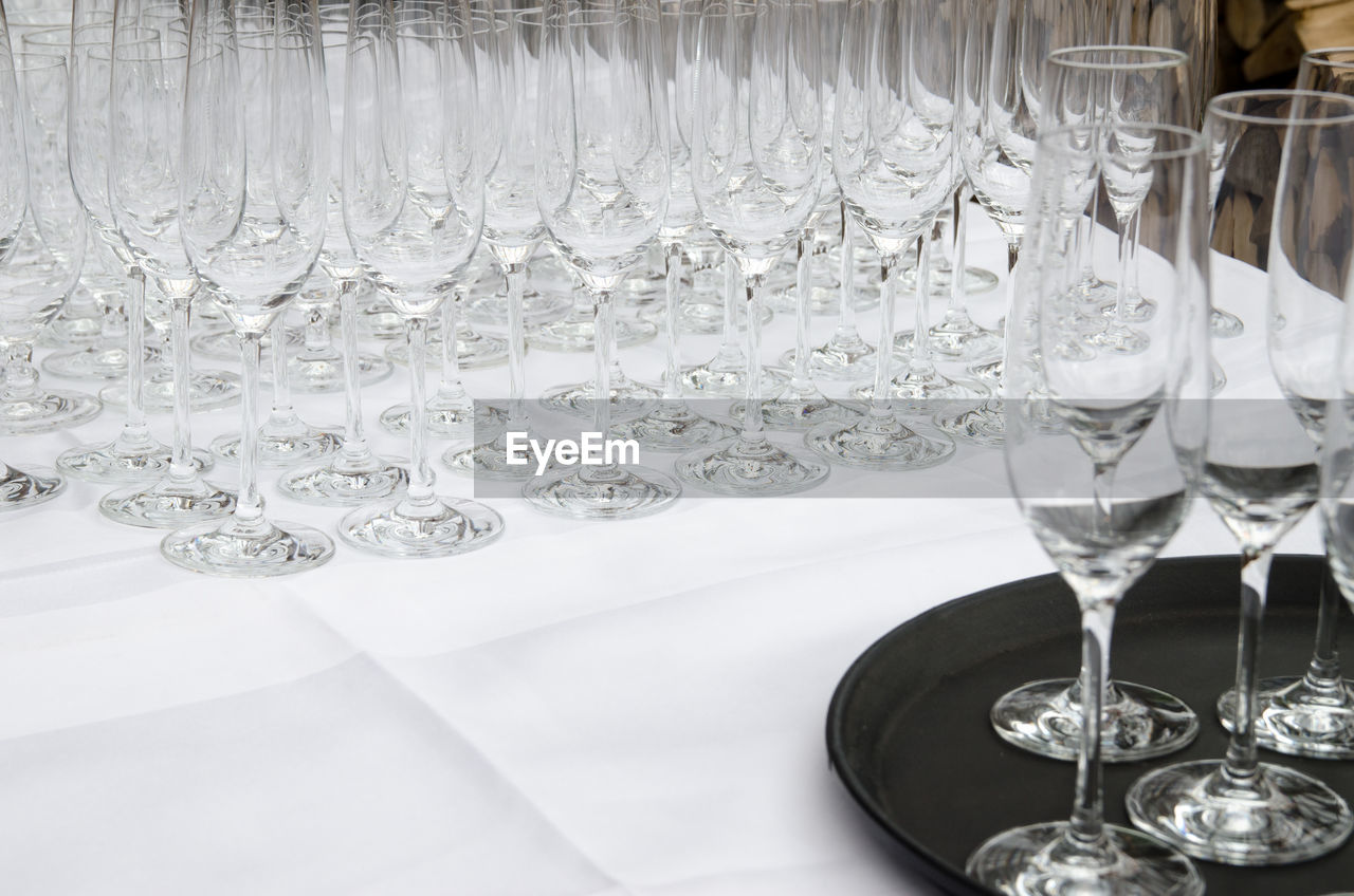 Champagne flutes arranged on table