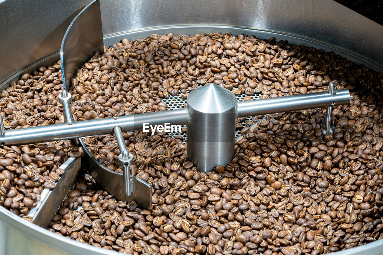 HIGH ANGLE VIEW OF COFFEE BEANS IN GLASS